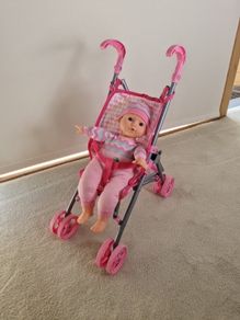 Baby buggy and doll