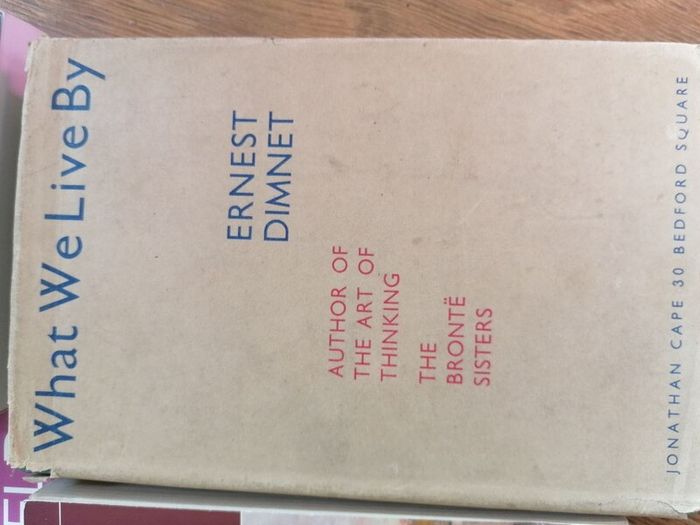Hardcover book What We Live By by Ernest Dimnet