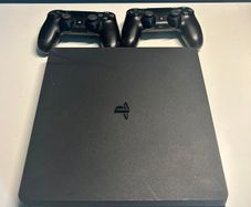 PlayStation 4 with 2 controllers, preloaded games and original box