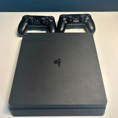 PlayStation 4 with 2 controllers, preloaded games and original box