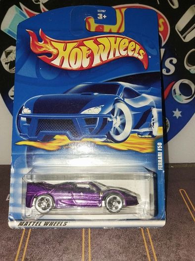 Hot Wheels Ferrari die-cast model cars from the mid-2000s and late 1990s card collections.