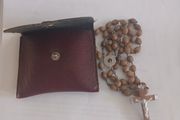 Title: Authentic Jerusalem Olive Wood Rosary &amp; Leather Case  Description: Selling an authentic Catholic rosary made from Holy Land olive wood beads. The back of the crucifix is stamped "JERUSALEM", and the center medal is stamped "TERRA SANTA" with a 