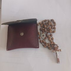 Title: Authentic Jerusalem Olive Wood Rosary & Leather Case  Description: Selling an authentic Catholic rosary made from Holy Land olive wood beads. The back of the crucifix is stamped "JERUSALEM", and the center medal is stamped "TERRA SANTA" with a 