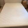 White faux leather 4ft 6in double bed frame, in as-new condition. Image 2