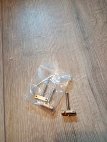 Compensated telecaster brass saddles