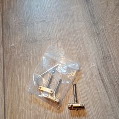 Compensated telecaster brass saddles