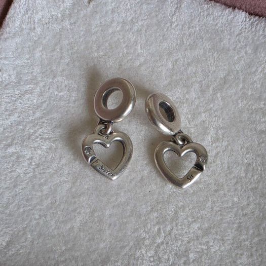 Pandora linked sister hearts split dangle charm. Very good condition hallmarked