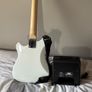 White electric guitar with amp box used only twice Image 5