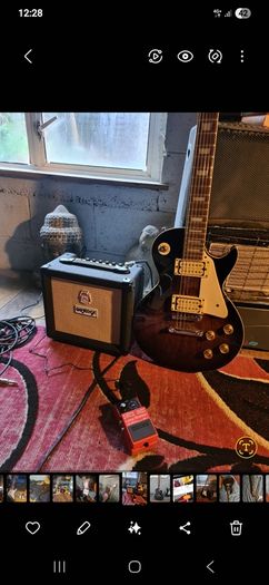 Les Paul style electric guitar with Orange 10W amp and Boss pedal