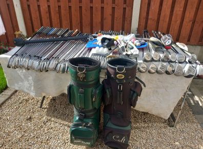 A selection of Golf clubs. Bags and golf balls.