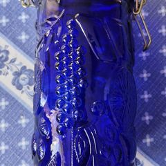 Neiman Marcus Vintage cobalt blue glass storage canister featuring an embossed fruit pattern