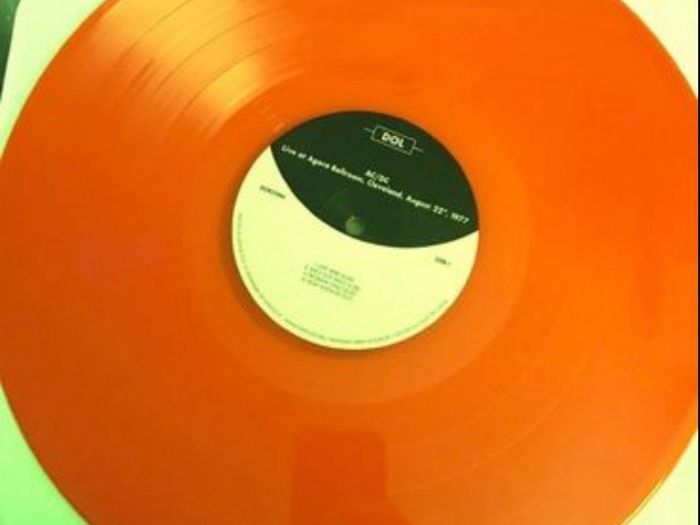 AC/DC limited edition orange coloured vinyl record. Mint condition. Recorded live at the Agora Ballroom Cleveland August 22nd 1977