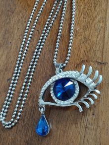 Vintage beautiful blue eye pendant on a long chain.