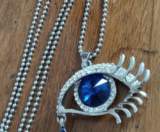 Vintage beautiful blue eye pendant on a long chain.