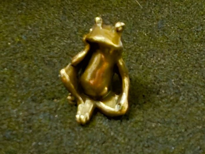 3 brass frogs.