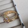 The ring has a unique stacked design with several bands and beautiful pastel/coloured stones, including purple, green and champagne tones. The hallmark has worn away over time, but the ring was tested today and confirmed as genuine 14K gold weight 3.95g. Image 9