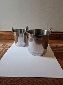 Two heavy metal ice buckets with stand