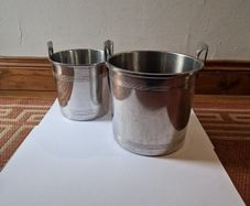 Two heavy metal ice buckets with stand
