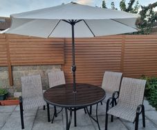 Garden table and chairs set with parasol