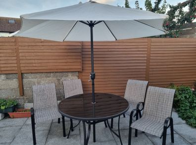 Garden table and chairs set with parasol