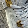 Air Jordan 4 White and Gold Trainers Image 7