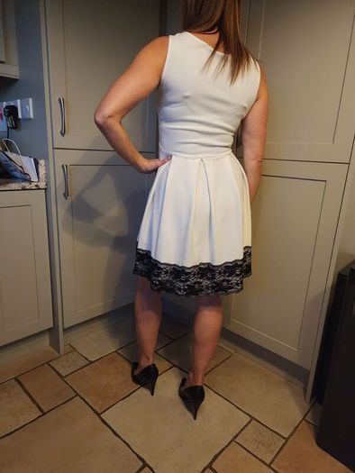 White dress with black lace trim