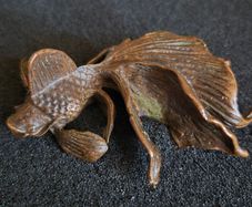 Bronze model of a koi carp.