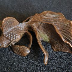 Bronze model of a koi carp.