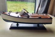 Wooden model replica of a classic Chris-Craft or Riva-style motorboat
