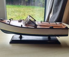 Wooden model replica of a classic Chris-Craft or Riva-style motorboat