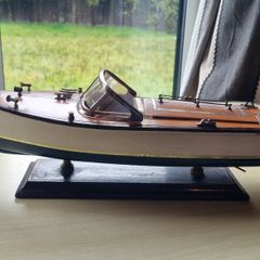 Wooden model replica of a classic Chris-Craft or Riva-style motorboat