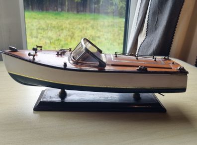 Wooden model replica of a classic Chris-Craft or Riva-style motorboat