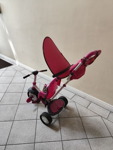 Pink toddler trike with parent handle and canopy