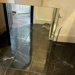 Two frameless mirrors