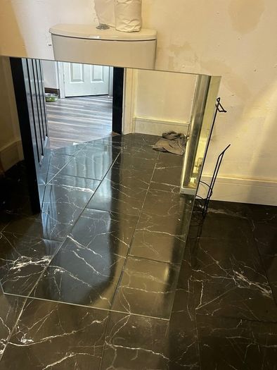 Two frameless mirrors