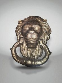 Lions head cast iron door knocker x 2