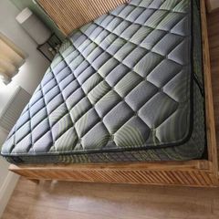 Super King mattress with wooden bed