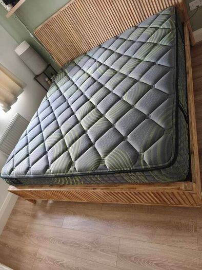 Super King mattress with wooden bed