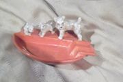 a vintage 1930 ash tray with a dog and two puppys