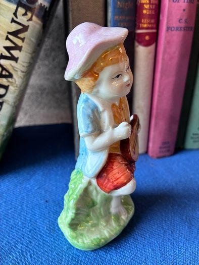 Vintage ceramic figurine of a young Boy Playing a Mandolin