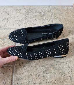 Black flats with silver heel (shoe rack)
