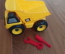 Yellow toy dump truck with take-apart tools