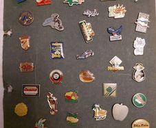 collection of over 100 pins from Volvic..Hollywood chewing gum..Fujicolor etc.