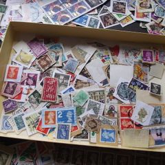 A box with collection of stamps from Great Britain