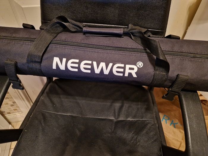 NEEWER, 2 Photography Tripods and feet and also 5ft circular Silver Light enhancer all in new condition and in lovely cases