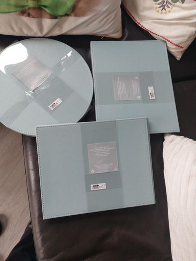 Sets of 4 circular placemats. Grey / duck egg.
