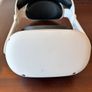 Meta Quest 2 Virtual reality headset. With 2 controllers. In near perfect condition ( barely used ). Has been restored to factory settings. Charges via usb C ( NOT included ). Original head strap was faulty so it had to be replaced. Image 2