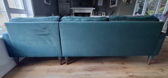 Green L shaped velvet couch. Reduced to 500