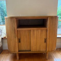 Fluted solid wood sideboard with sliding doors