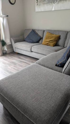 Gray fabric corner chase sofa with footstool